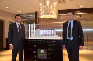 Christophe et Bruno Massuco devant la maquette du futur Holiday'Inn Toison d'Or dont le chantier...