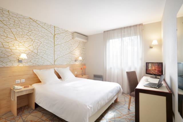Une chambre de l'hôtel Frênes